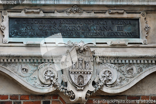 Image of The plaque in the wall of St Mary's Church in Cracow