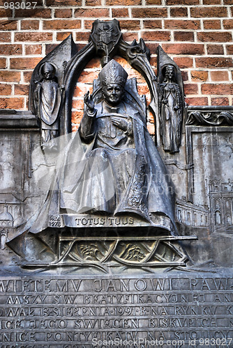 Image of The plaque in the wall of St Mary's Church in Cracow