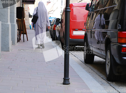 Image of Nun goes the old streets of Cracow