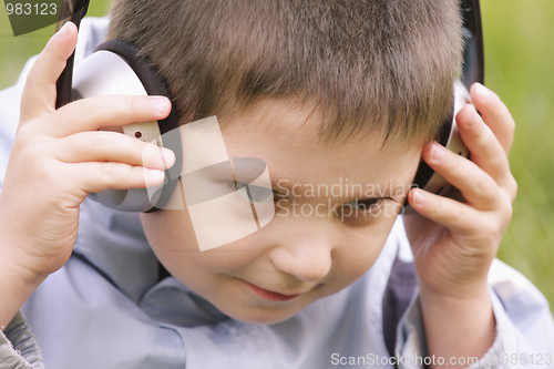 Image of Portrait of serene boy in headphones