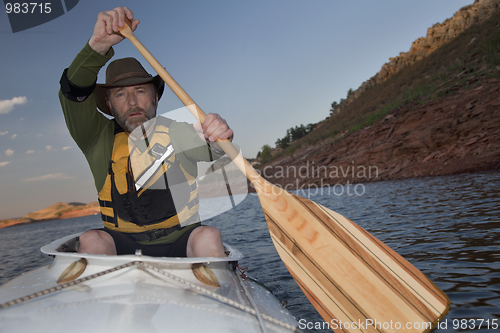 Image of mature male in a canoe