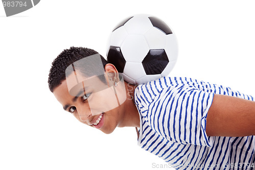 Image of handsome latin boy holding a soccer ball