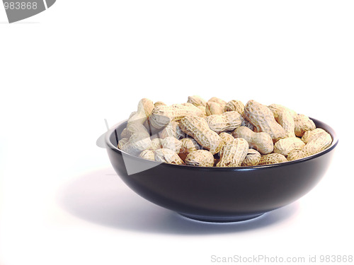 Image of Black bowl with unshelled peanuts