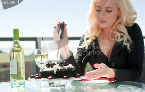 Image of woman with chocolate cake dessert