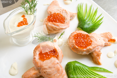 Image of roasted salmon filet with red caviar