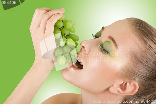 Image of woman with grape