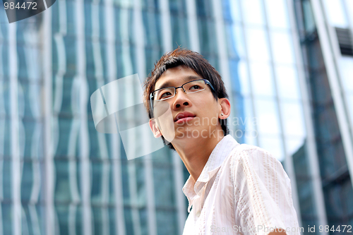 Image of Portrait of a happy young businessman