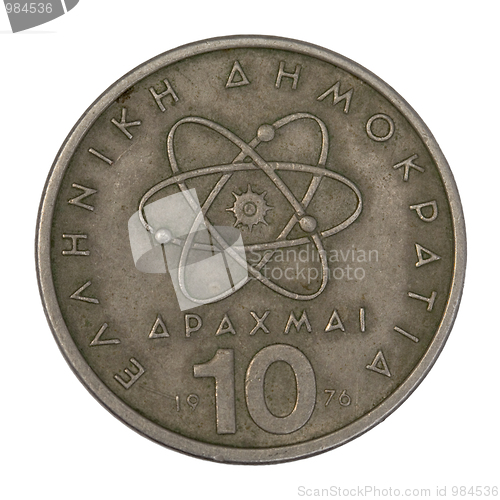 Image of scientific model of atom on old Greek coin