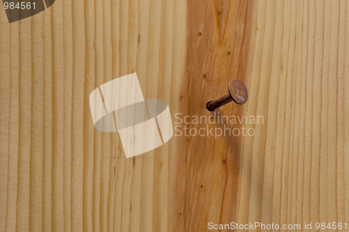 Image of rusty nail and wood