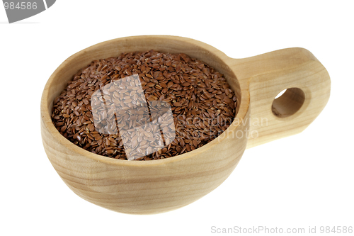 Image of scoop of brown flax seeds