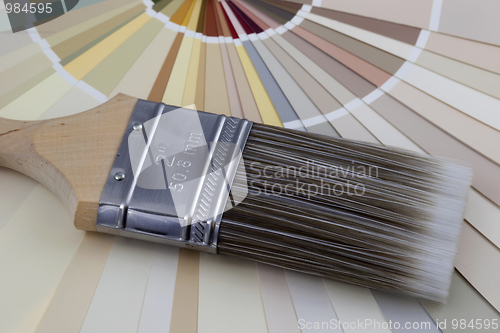 Image of paintbrush and paint color swatches