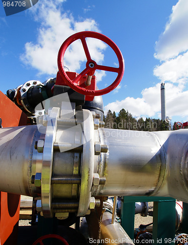 Image of Industrial zone, Steel pipelines and valves against blue sky