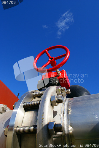 Image of Industrial zone, Steel pipelines and valves against blue sky