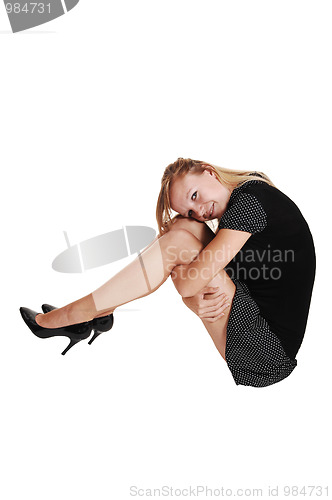 Image of Girl sitting on floor.