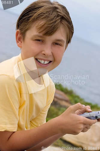 Image of Child with handheld game