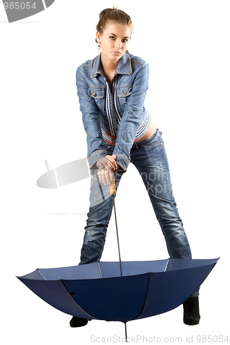Image of Playful woman in a blue denim suit