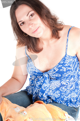 Image of Portrait of pretty pregnant woman baby clothes