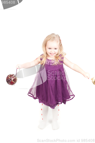 Image of Studio shot of baby girl in gala dress