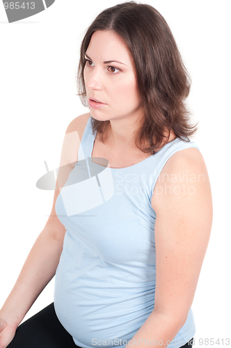 Image of Portrait of pretty pregnant woman practicing yoga