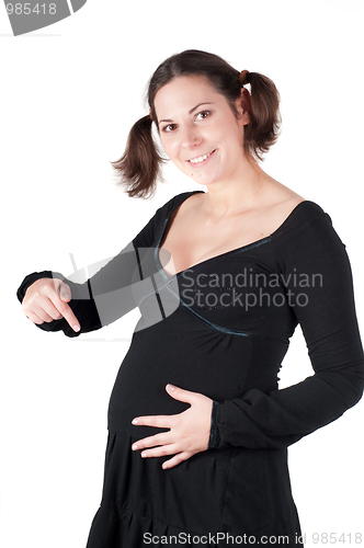 Image of Portrait of pretty pregnant woman in black dress