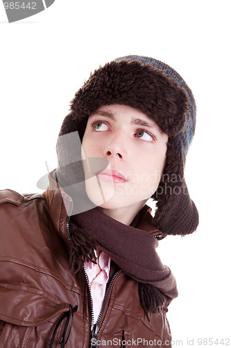 Image of Young boy looking serious, with hat and winter clothes