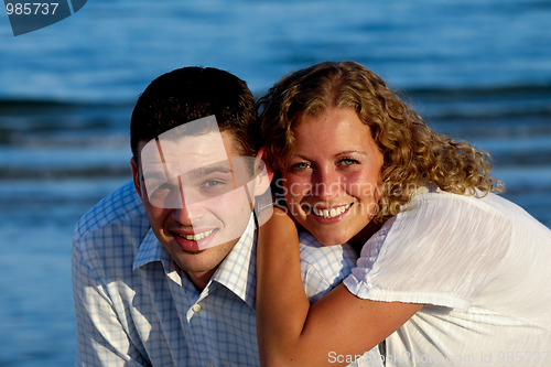 Image of Happy young couple at beach