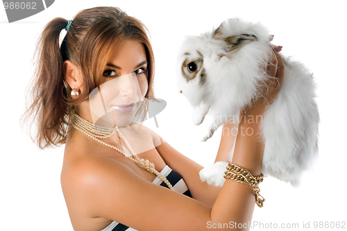 Image of Smiling young woman with little rabbit