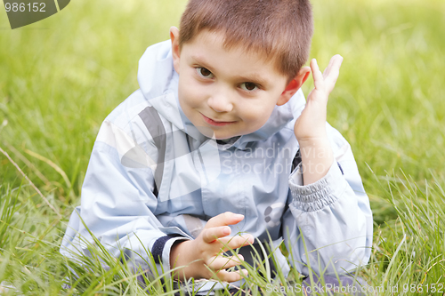 Image of Cute little boy in grass