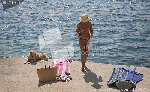 Image of Bikini woman by the sea