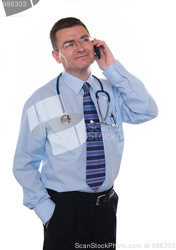 Image of Smiling doctor makes phone call