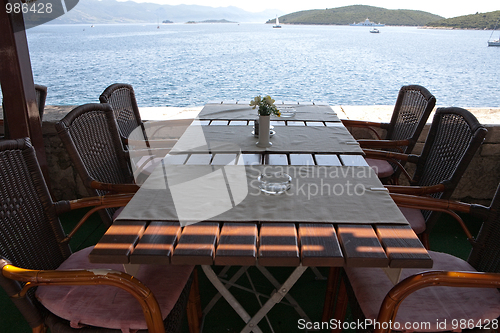 Image of table in open air restaurant on sea resort