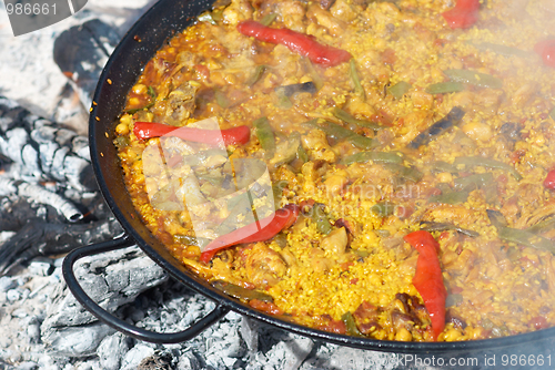 Image of Traditional paella cooking