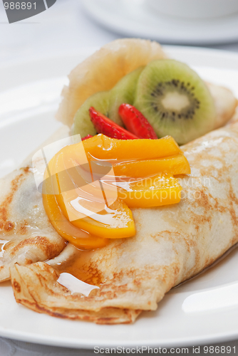 Image of Pancakes with fruit on top