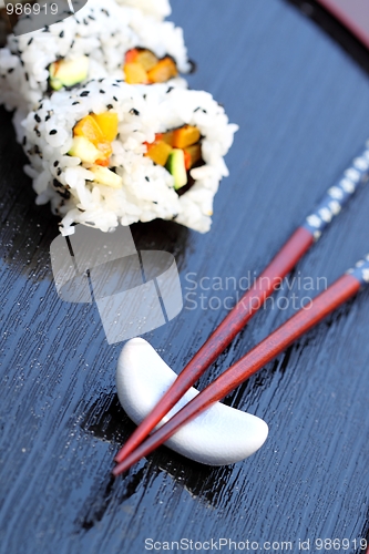 Image of chopsticks sushi