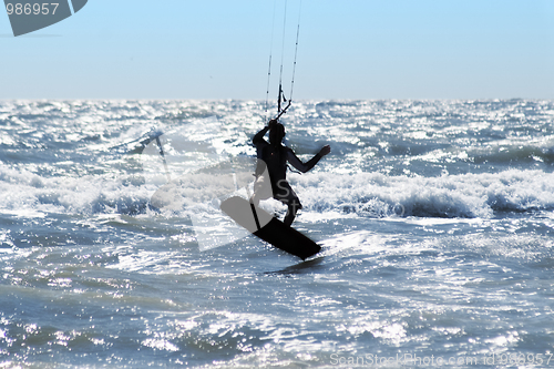 Image of Silhouette of kite surfer