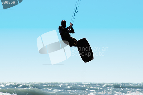 Image of Silhouette of kite surfer