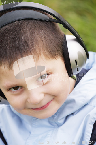 Image of Portrait of smiling kid in headphones