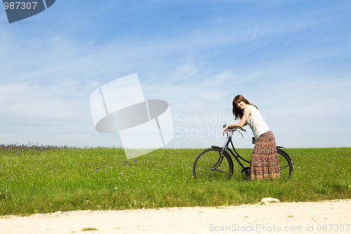 Image of Girl with a bicycle