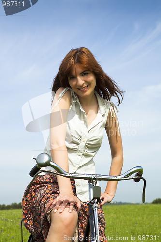 Image of Girl with a bicycle