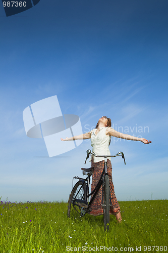 Image of Girl with a bicycle