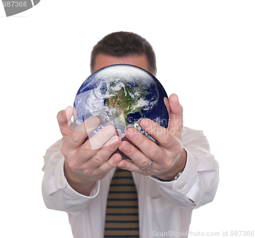 Image of Businessman holds globe featuring America