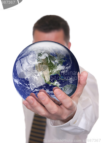 Image of Businessman holds globe featuring America