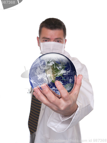 Image of Doctor holds world globe featuring America