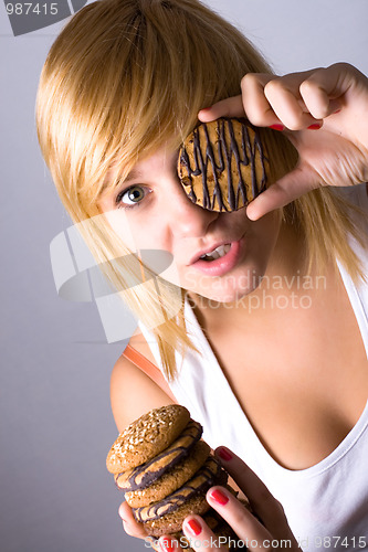 Image of woman eating chocolate chip cookies