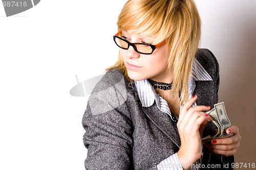 Image of businesswoman with money