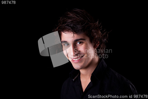Image of cute boy, smiling on black