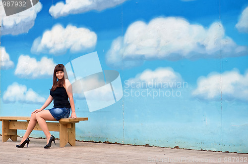 Image of Beauty girl on the background of sky.