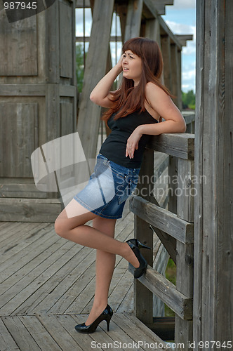 Image of Beauty girl on the old-time bridge.