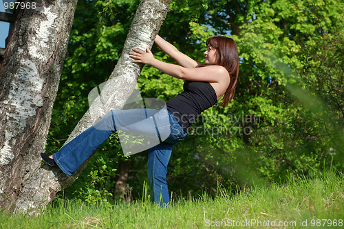 Image of Young woman with tree.