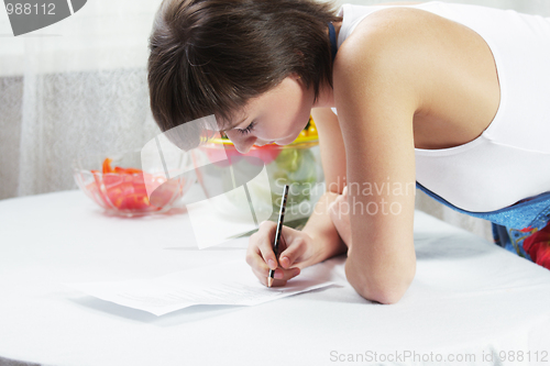 Image of Housewife making notes